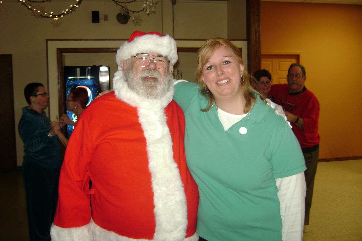 Photo from a Holiday party with a smiling santa